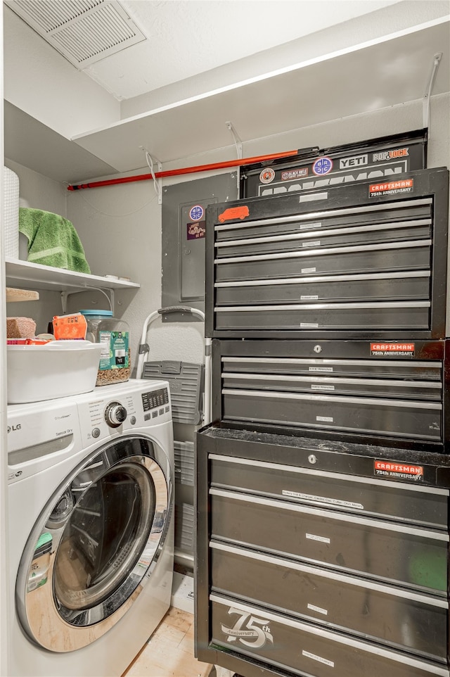 washroom with washer / dryer