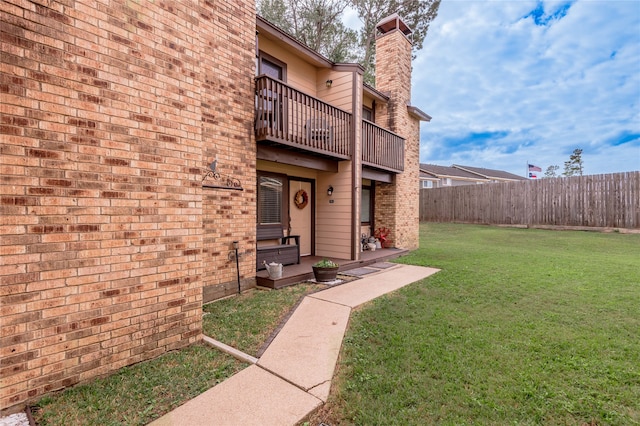 view of yard featuring a balcony