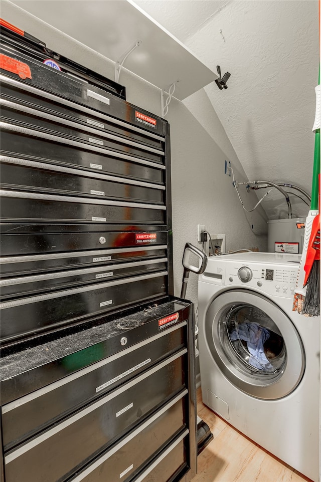 washroom featuring washer / dryer and light hardwood / wood-style flooring