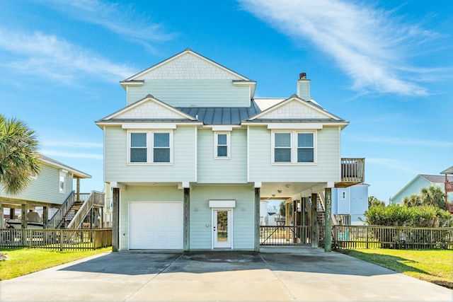 view of front of house featuring a garage and a carport