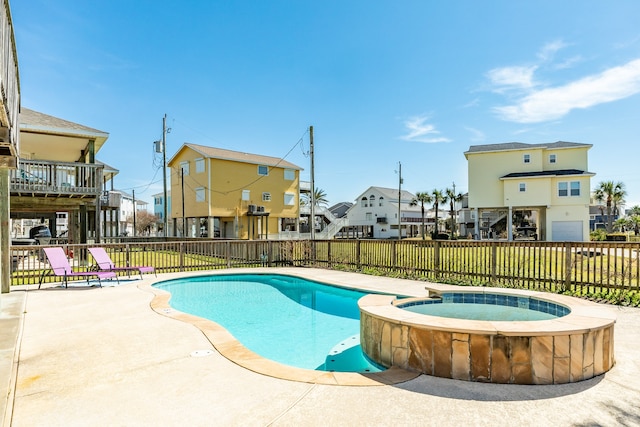 view of swimming pool with a lawn, an in ground hot tub, and a patio