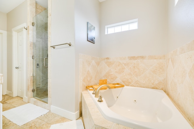 bathroom featuring tile patterned flooring and separate shower and tub