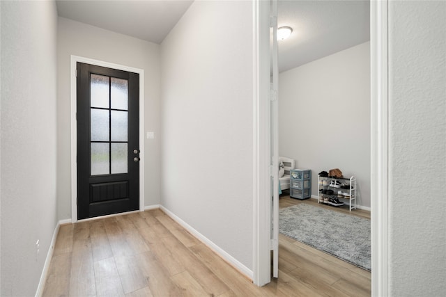 entryway with light hardwood / wood-style floors