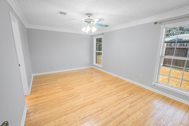 unfurnished room with crown molding, ceiling fan, a textured ceiling, and light hardwood / wood-style floors