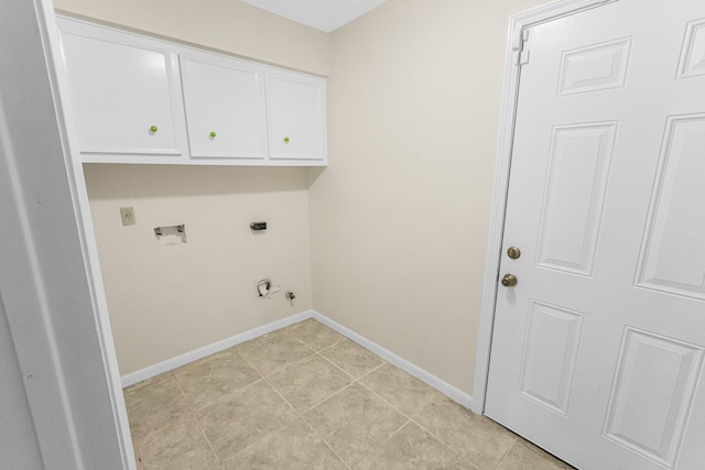 washroom with light tile patterned flooring, gas dryer hookup, cabinets, electric dryer hookup, and washer hookup