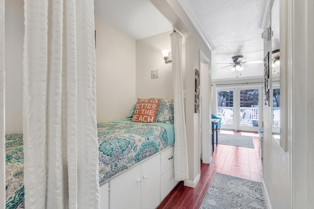 bedroom featuring access to exterior, ceiling fan, and wood-type flooring