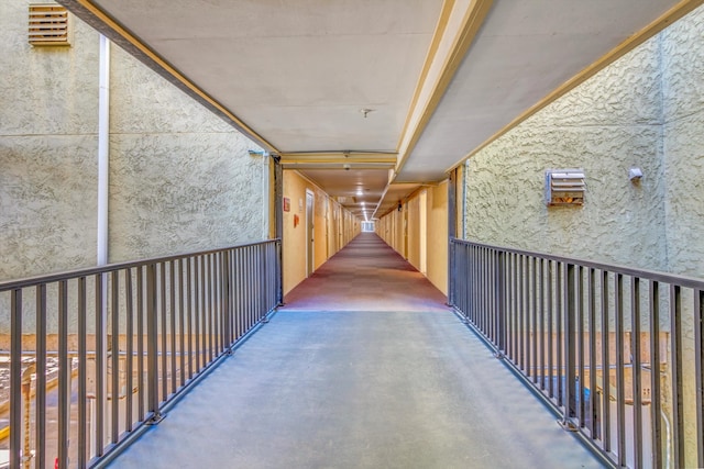 corridor with concrete flooring