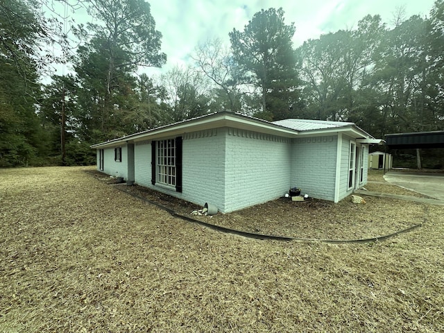 view of property exterior with a carport