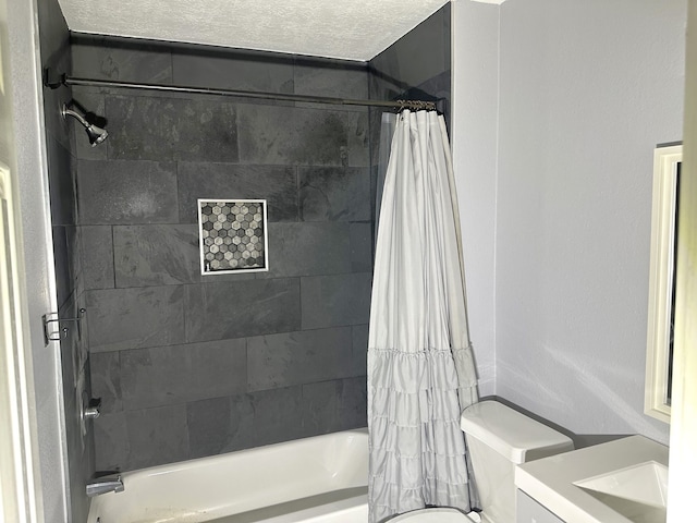 full bathroom featuring shower / bath combination with curtain, toilet, a textured ceiling, and vanity