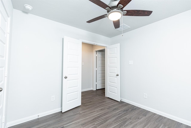 unfurnished bedroom featuring hardwood / wood-style flooring and ceiling fan