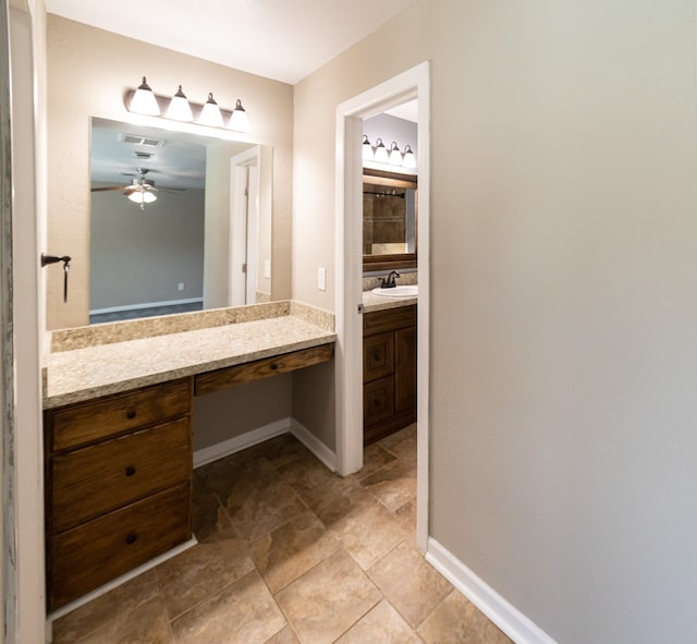 bathroom with ceiling fan, tile patterned flooring, and vanity