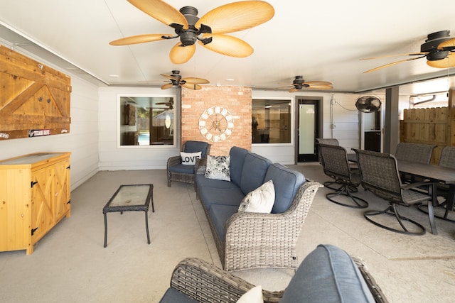 living room featuring ceiling fan and wooden walls