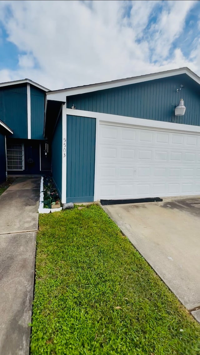 garage with a yard