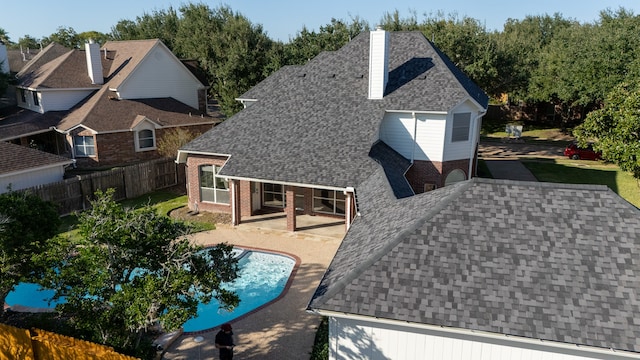 rear view of property featuring a patio area