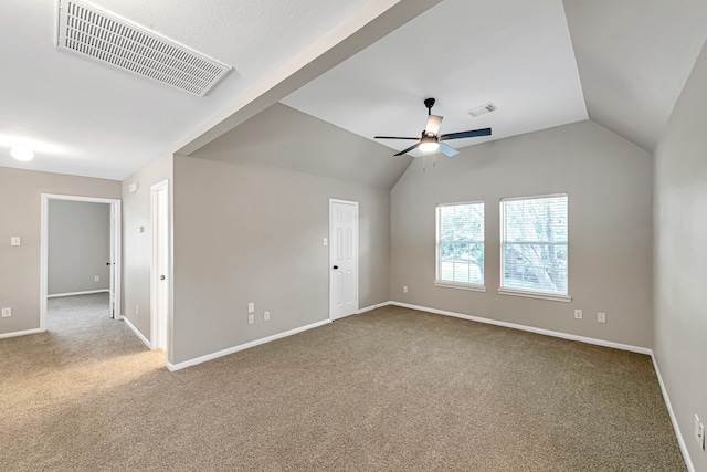 unfurnished room with carpet flooring, ceiling fan, and vaulted ceiling