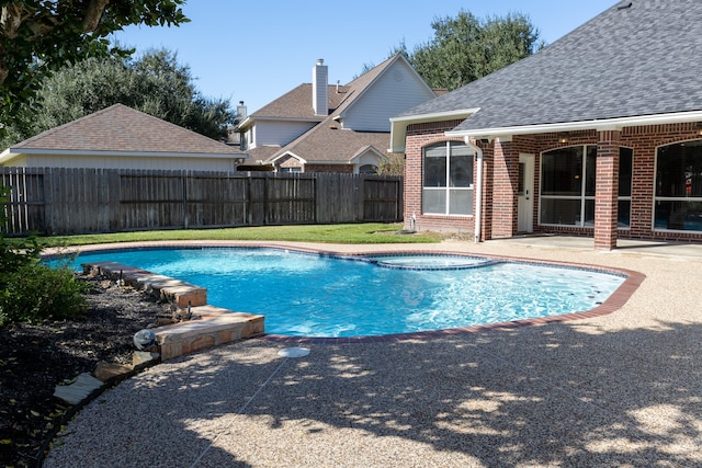 view of swimming pool with a patio area