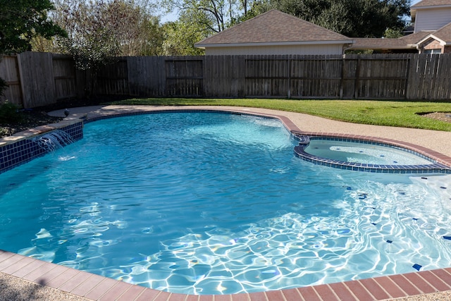 view of swimming pool featuring pool water feature and an in ground hot tub