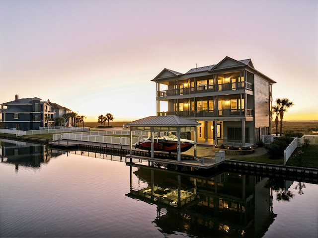 exterior space with a balcony and a water view