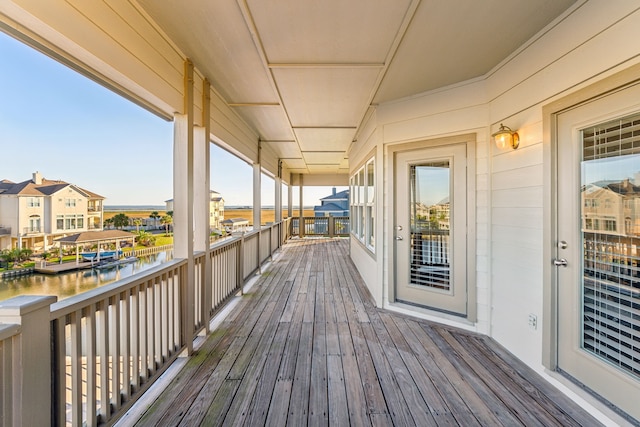 wooden deck with a water view