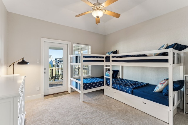 bedroom with light carpet, access to exterior, and ceiling fan