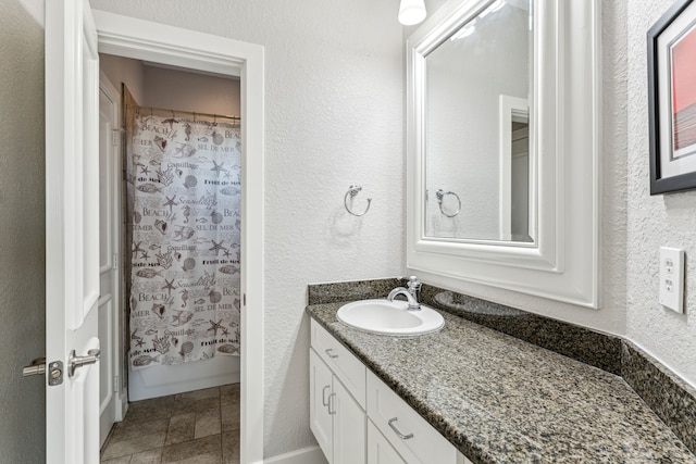 bathroom with vanity and shower / bath combo with shower curtain