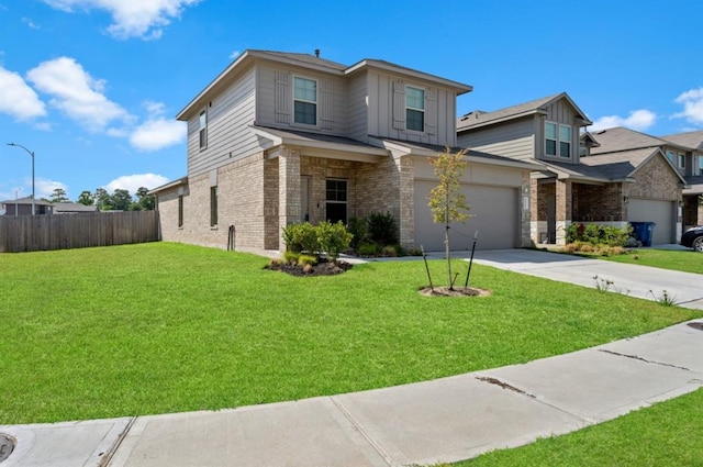 view of front facade with a front yard and a garage