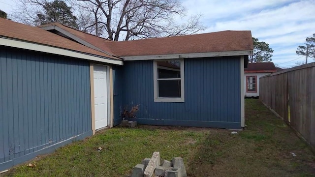 view of side of property featuring a yard