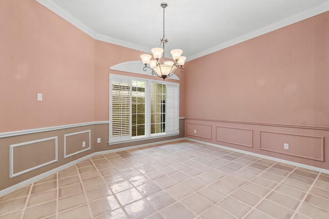 unfurnished room with a notable chandelier, ornamental molding, and light tile patterned floors