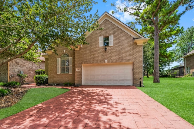 view of front property with a garage and a front lawn