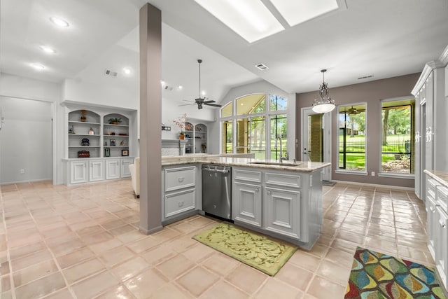 kitchen with gray cabinetry, ceiling fan, dishwasher, sink, and vaulted ceiling