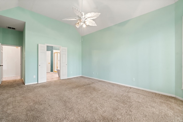 unfurnished bedroom featuring ceiling fan, high vaulted ceiling, and light colored carpet