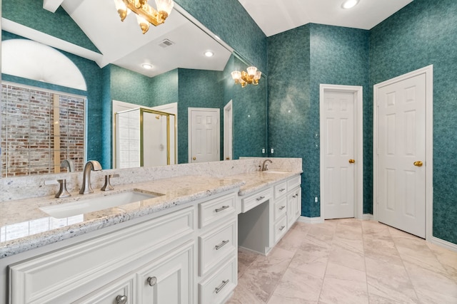 bathroom with vanity, vaulted ceiling, and an enclosed shower