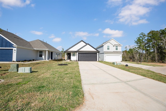 view of front of property featuring a front lawn and a garage