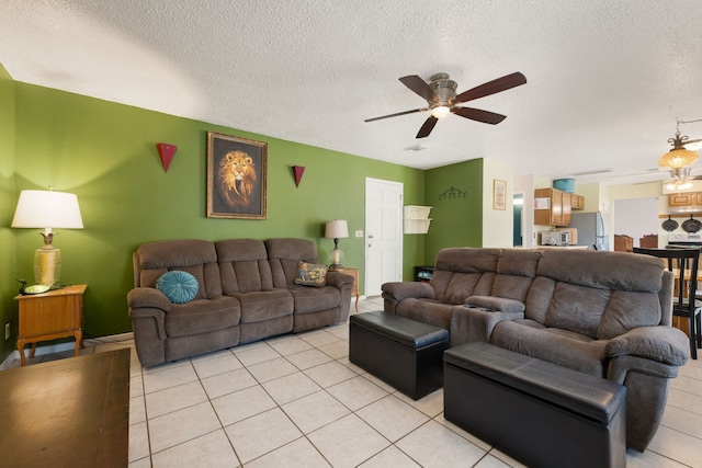 tiled living room featuring ceiling fan and a textured ceiling