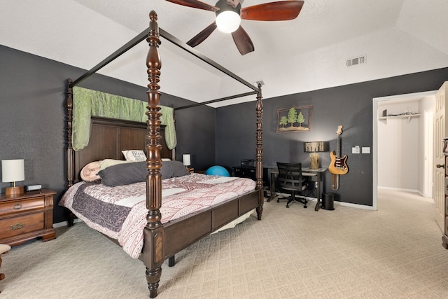 carpeted bedroom with ceiling fan and lofted ceiling