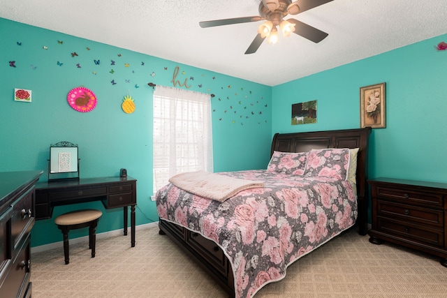 bedroom with light carpet, a textured ceiling, and ceiling fan