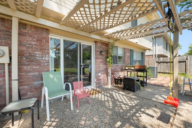 view of patio / terrace featuring a pergola and central AC unit