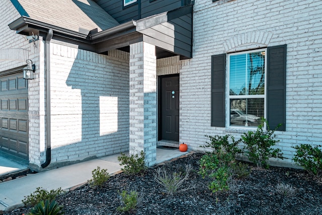 property entrance with a garage