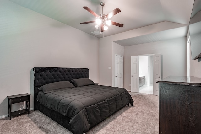 carpeted bedroom featuring ceiling fan and vaulted ceiling