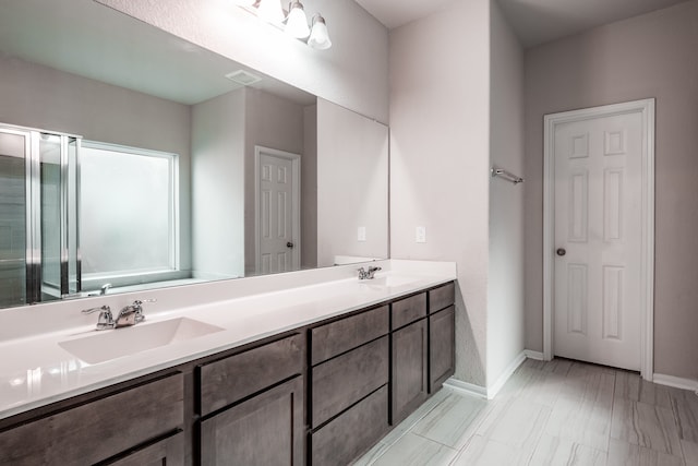 bathroom with vanity and walk in shower