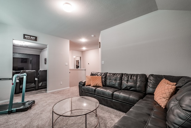 living room featuring carpet floors and lofted ceiling