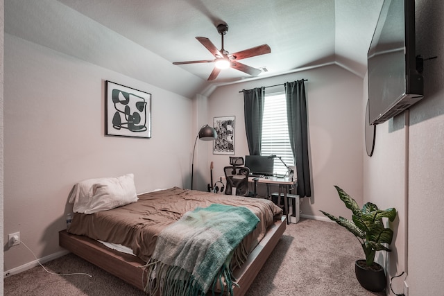 bedroom with dark colored carpet, ceiling fan, and vaulted ceiling