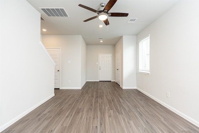 interior space featuring hardwood / wood-style floors and ceiling fan