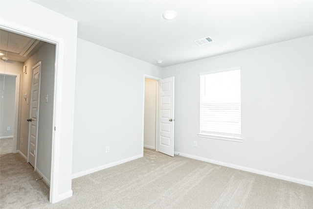 unfurnished room with light carpet