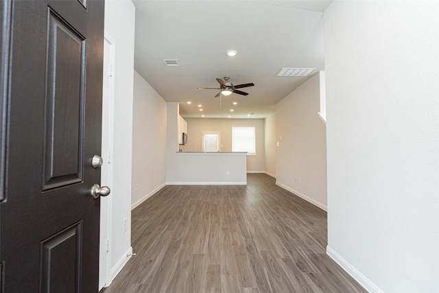 foyer featuring ceiling fan and hardwood / wood-style flooring