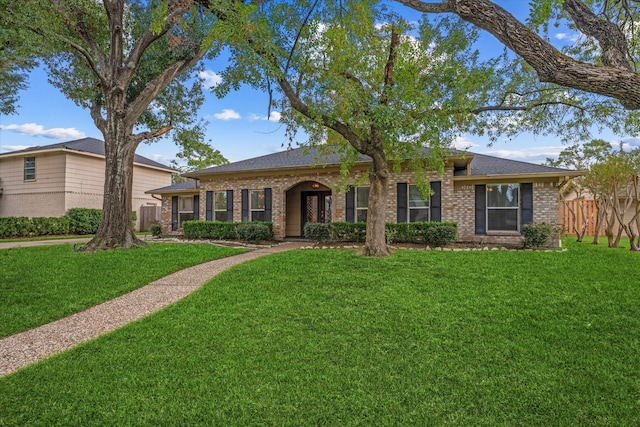 ranch-style house with a front lawn