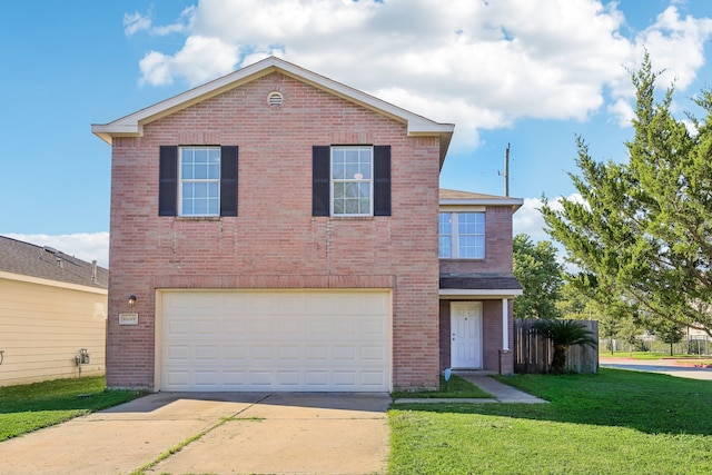 view of property featuring a front yard and a garage