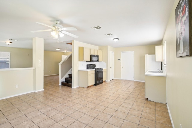 kitchen featuring light countertops, visible vents, ceiling fan, and black appliances