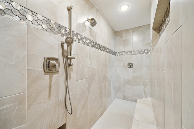 bathroom with tiled shower