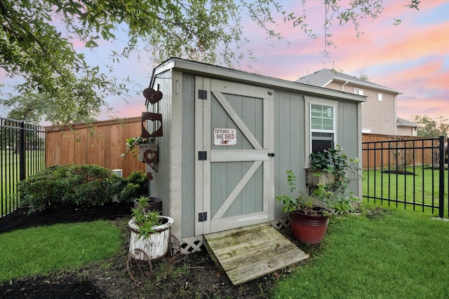 outdoor structure at dusk with a yard